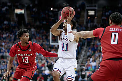 Mar 12, 2022; Kansas City, MO, USA;  Kansas Jayhawks guard Remy Martin (11) looks to pass during the first half against the Texas Tech Red Raidersat T-Mobile Center. Mandatory Credit: William Purnell-USA TODAY Sports