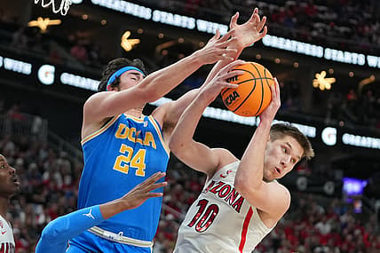 Mar 12, 2022; Las Vegas, NV, USA; Arizona Wildcats forward Azuolas Tubelis (10) pulls a rebound away from UCLA Bruins guard Jaime Jaquez Jr. (24) during the first half at T-Mobile Arena. Mandatory Credit: Stephen R. Sylvanie-USA TODAY Sports