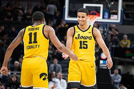 Mar 13, 2022; Indianapolis, IN, USA; Iowa Hawkeyes guard Tony Perkins (11) and forward Keegan Murray (15) celebrate beating Purdue Boilermakers at Gainbridge Fieldhouse. Mandatory Credit: Trevor Ruszkowski-USA TODAY Sports