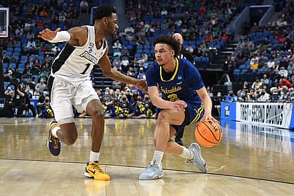 Mar 17, 2022; Buffalo, NY, USA; South Dakota State Jackrabbits guard Zeke Mayo (2) dribbles the ball against Providence Friars guard Al Durham (1) in the first half during the first round of the 2022 NCAA Tournament at KeyBank Center. Mandatory Credit: Mark Konezny-USA TODAY Sports