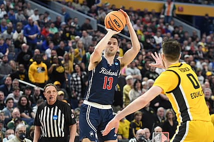 Mar 17, 2022; Buffalo, NY, USA; Richmond Spiders guard Connor Crabtree (13) shoots the ball against Iowa Hawkeyes forward Filip Rebraca (0) in the second half during the first round of the 2022 NCAA Tournament at KeyBank Center. Mandatory Credit: Mark Konezny-USA TODAY Sports