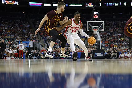 Mar 18, 2022; Pittsburgh, PA, USA; Ohio State Buckeyes guard Malaki Branham (22) looks to move the ball around Loyola (Il) Ramblers guard Tate Hall (24) in the first half during the first round of the 2022 NCAA Tournament at PPG Paints Arena. Mandatory Credit: Geoff Burke-USA TODAY Sports