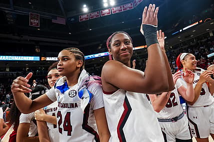 Mar 18, 2022; Columbia, South Carolina, USA; South Carolina Gamecocks guard LeLe Grissett (24) and South Carolina Gamecocks forward Aliyah Boston (4) celebrate their win over the Howard Lady Bison at Colonial Life Arena. Mandatory Credit: Jeff Blake-USA TODAY Sports