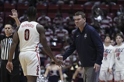 Mar 18, 2022; San Diego, CA, USA; Arizona Wildcats head coach Tommy Lloyd (right) high-fives guard Bennedict Mathurin (0) against the Wright State Raiders during the first half during the first round of the 2022 NCAA Tournament at Viejas Arena. Mandatory Credit: Kirby Lee-USA TODAY Sports