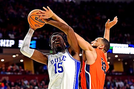Mar 18, 2022; Greenville, SC, USA; Duke Blue Devils center Mark Williams (15) shoots the ball against Cal State Fullerton Titans forward Vincent Lee (13) during the second half during the first round of the 2022 NCAA Tournament at Bon Secours Wellness Arena. Mandatory Credit: Bob Donnan-USA TODAY Sports