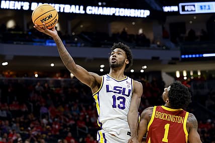 Mar 18, 2022; Milwaukee, WI, USA; LSU Tigers forward Tari Eason (13) drives to the basket against Iowa State Cyclones guard Izaiah Brockington (1) in the first half during the first round of the 2022 NCAA Tournament at Fiserv Forum. Mandatory Credit: Jeff Hanisch-USA TODAY Sports