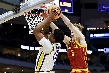 Mar 18, 2022; Milwaukee, WI, USA; LSU Tigers guard Brandon Murray (0) drives to the basket and is blocked by Iowa State Cyclones forward Aljaz Kunc (5) in the first half during the first round of the 2022 NCAA Tournament at Fiserv Forum. Mandatory Credit: Jeff Hanisch-USA TODAY Sports