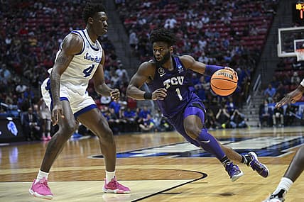 Mar 18, 2022; San Diego, CA, USA; TCU Horned Frogs guard Mike Miles (1) dribbles the basketball against Seton Hall Pirates forward Tyrese Samuel (4) during the second half during the first round of the 2022 NCAA Tournament at Viejas Arena. Mandatory Credit: Orlando Ramirez-USA TODAY Sports