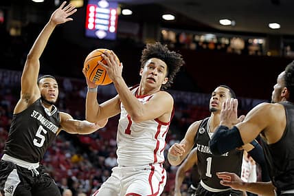 Oklahoma's Jalen Hill (1) catches the ball between St. Bonaventure's Jaren Holmes (5) and Dominick Welch (1) during a men's college basketball game between the University of Oklahoma Sooners (OU) and St. Bonaventure at Lloyd Noble Center in Norman, Okla., Sunday, March 20, 2022.

Ou Nit