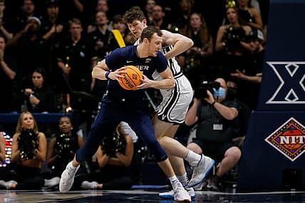 Xavier Musketeers forward Jack Nunge (24) drives against Vanderbilt Commodores forward Quentin Millora-Brown (42) in the first half of the NIT Quarter Final game between the Xavier Musketeers and the Vanderbilt Commodores at the Cintas Center in Cincinnati on Tuesday, March 22, 2022. Vanderbilt led 31-29 at halftime.

Vanderbilt Commodores Vs Xavier Musketeers Nit