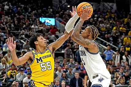 Mar 24, 2022; San Antonio, TX, USA; Villanova Wildcats guard Justin Moore (5) drives to the basket against Michigan Wolverines guard Eli Brooks (55) in the semifinals of the South regional of the men's college basketball NCAA Tournament at AT&T Center. Mandatory Credit: Scott Wachter-USA TODAY Sports