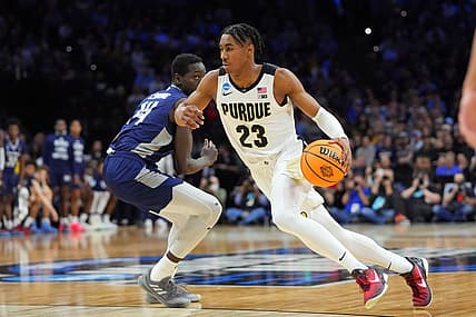 Mar 25, 2022; Philadelphia, PA, USA; Purdue Boilermakers guard Jaden Ivey (23) controls the ball against St. Peter's Peacocks forward Hassan Drame (14) in the second half in the semifinals of the East regional of the men's college basketball NCAA Tournament at Wells Fargo Center. Mandatory Credit: Mitchell Leff-USA TODAY Sports