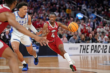 Mar 26, 2022; San Francisco, CA, USA; Arkansas Razorbacks guard Davonte Davis (4) dribbles the ball against Duke Blue Devils forward Paolo Banchero (5) during the first half in the finals of the West regional of the men's college basketball NCAA Tournament at Chase Center. Mandatory Credit: Kelley L Cox-USA TODAY Sports