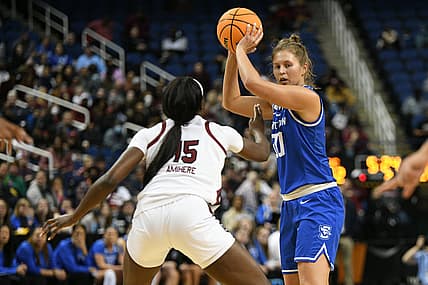 Mar 27, 2022; Greensboro, NC, USA; Creighton Bluejays guard Morgan Maly (30) looks under the basket with South Carolina Gamecocks forward Laeticia Amihere (15) guarding tightly in the second quarter in the Greensboro regional finals of the women's college basketball NCAA Tournament at Greensboro Coliseum. Mandatory Credit: William Howard-USA TODAY Sports