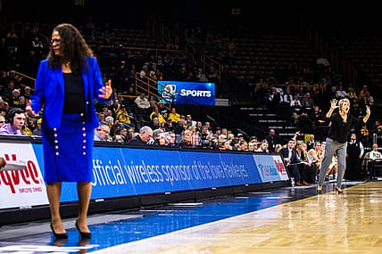 Iowa head coach Lisa Bluder, far right, calls out to players while Rutgers head coach C. Vivian Stringer, left, looks to her bench during a NCAA Big Ten Conference women's basketball game on Wednesday, Jan. 23, 2019, at Carver-Hawkeye Arena in Iowa City, Iowa.

190123 Wbb Rutgers 018 Jpg