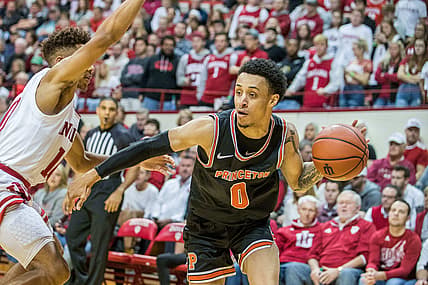 Nov 20, 2019; Bloomington, IN, USA; Princeton Tigers guard Jaelin Llewellyn (0) dribbles the ball against Indiana Hoosiers guard Rob Phinisee (left) in the second half at Simon Skjodt Assembly Hall. Mandatory Credit: Trevor Ruszkowski-USA TODAY Sports