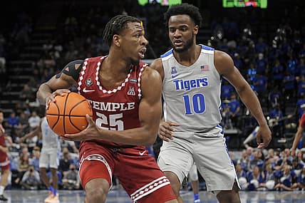 Feb 24, 2022; Memphis, Tennessee, USA; Temple Owls guard Jeremiah Williams (25) looks to pass the ball as Memphis Tigers guard Alex Lomax (10) defends during the first half at FedExForum. Mandatory Credit: Petre Thomas-USA TODAY Sports