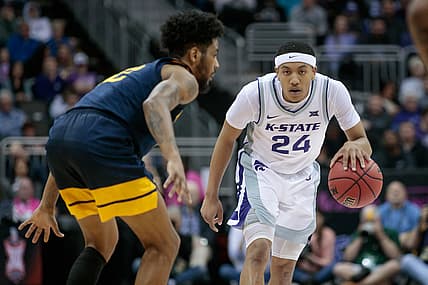 Mar 9, 2022; Kansas City, MO, USA; Kansas State Wildcats guard Nijel Pack (24) brings the ball up court during the second half against the West Virginia Mountaineers at T-Mobile Center. Mandatory Credit: William Purnell-USA TODAY Sports