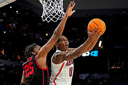 Mar 24, 2022; San Antonio, TX, USA; Arizona Wildcats guard Bennedict Mathurin (0) drives to the basket against Houston Cougars center Josh Carlton (25) during the second half in the semifinals of the South regional of the men's college basketball NCAA Tournament at AT&T Center. Mandatory Credit: Daniel Dunn-USA TODAY Sports