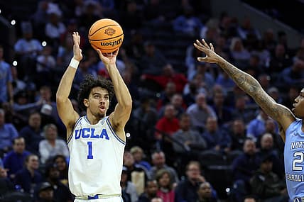 Mar 25, 2022; Philadelphia, PA, USA; UCLA Bruins guard Jules Bernard (1) shoots against North Carolina Tar Heels guard Caleb Love (2) in the second half in the semifinals of the East regional of the men's college basketball NCAA Tournament at Wells Fargo Center. Mandatory Credit: Bill Streicher-USA TODAY Sports