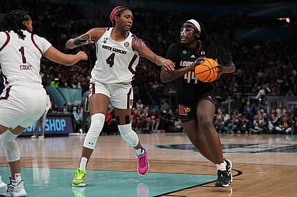 Apr 1, 2022; Minneapolis, MN, USA; Louisville Cardinals forward Olivia Cochran (44) controls the ball as South Carolina Gamecocks forward Aliyah Boston (4) defends in the second half in the Final Four semifinals of the women's college basketball NCAA Tournament at Target Center. Mandatory Credit: Kirby Lee-USA TODAY Sports