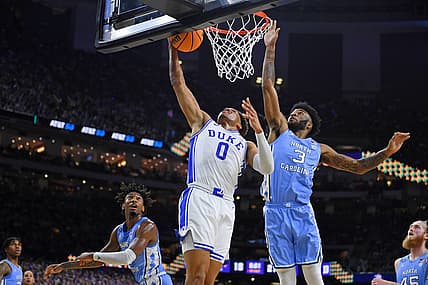 Apr 2, 2022; New Orleans, LA, USA; Duke Blue Devils forward Wendell Moore Jr. (0) misses his shot against North Carolina Tar Heels guard Dontrez Styles (3) during the first half during the 2022 NCAA men's basketball tournament Final Four semifinals at Caesars Superdome. Mandatory Credit: Bob Donnan-USA TODAY Sports