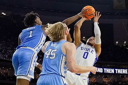 Apr 2, 2022; New Orleans, LA, USA; North Carolina Tar Heels forward Leaky Black (1) blocks the shot of Duke Blue Devils forward Wendell Moore Jr. (0) during the first half during the 2022 NCAA men's basketball tournament Final Four semifinals at Caesars Superdome. Mandatory Credit: Bob Donnan-USA TODAY Sports