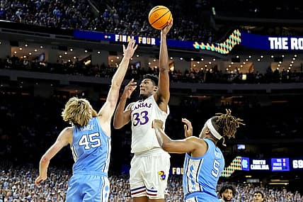Apr 4, 2022; New Orleans, LA, USA; Kansas Jayhawks forward David McCormack (33) shoots the ball against North Carolina Tar Heels forward Brady Manek (45) and forward Armando Bacot (5) during the 2022 NCAA men's basketball tournament Final Four championship game at Caesars Superdome. Mandatory Credit: Robert Deutsch-USA TODAY Sports