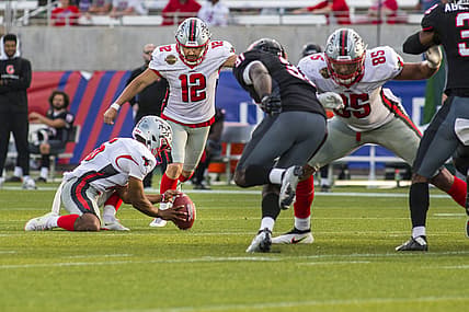Apr 30, 2022; Birmingham, AL, USA; Tampa Bay Bandits kicker Tyler Rausa (12) kicks the game winning field goal against the Houston Gamblers with 14 seconds left in the second half at Protective Stadium. Mandatory Credit: Vasha Hunt-USA TODAY Sports
