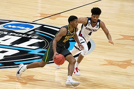 April 5, 2021; Indianapolis, IN, USA; Baylor Bears guard Jared Butler (12) dribbles the basketball against Gonzaga Bulldogs guard Aaron Cook (4) in the second half during the national championship game in the Final Four of the 2021 NCAA Tournament at Lucas Oil Stadium. Mandatory Credit: Kyle Terada-USA TODAY Sports