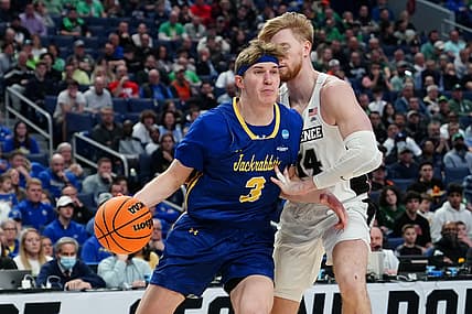 Mar 17, 2022; Buffalo, NY, USA; South Dakota State Jackrabbits guard Baylor Scheierman (3) drives to the basket against Providence Friars forward Noah Horchler (14) in the second half during the first round of the 2022 NCAA Tournament at KeyBank Center. Mandatory Credit: Gregory Fisher-USA TODAY Sports