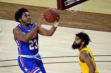 Nov 29, 2020; Tempe, Arizona, USA; Houston Baptist Huskies guard Darius Lee (23) puts up a layup against Arizona State Sun Devils guard Remy Martin (1) during the first half at Desert Financial Arena (Tempe). Mandatory Credit: Joe Camporeale-USA TODAY Sports