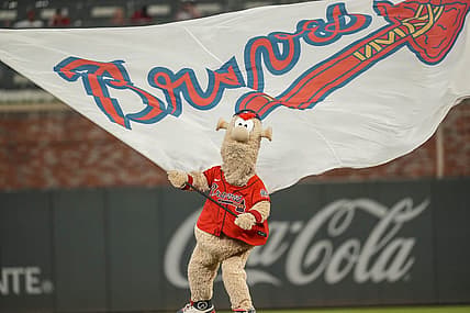 Aug 6, 2021; Cumberland, Georgia, USA; Atlanta Braves mascot Blooper waves the flag after the Braves defeated the Washington Nationals at Truist Park. Mandatory Credit: Dale Zanine-USA TODAY Sports