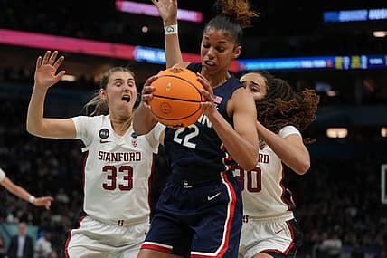 Apr 1, 2022; Minneapolis, MN, USA; UConn Huskies guard Evina Westbrook (22) battles for a rebound with Stanford Cardinal guard Hannah Jump (33) and Stanford Cardinal guard Haley Jones (30) during the second half in the Final Four semifinals of the women's college basketball NCAA Tournament at Target Center. Mandatory Credit: Kirby Lee-USA TODAY Sports