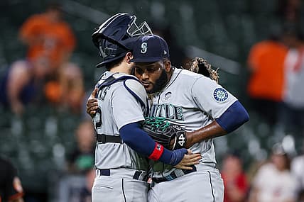 Jun 2, 2022; Baltimore, Maryland, USA; Seattle Mariners catcher Luis Torrens (22) celebrates with relief pitcher Diego Castillo (63) after the final pitch of the game against the Baltimore Orioles at Oriole Park at Camden Yards. Mandatory Credit: Scott Taetsch-USA TODAY Sports