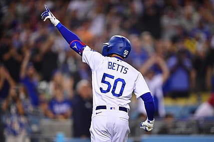 Jun 14, 2022; Los Angeles, California, USA; Los Angeles Dodgers right fielder Mookie Betts (50) celebrates his solo home run hit against the Los Angeles Angels during the eighth inning at Dodger Stadium. Mandatory Credit: Gary A. Vasquez-USA TODAY Sports