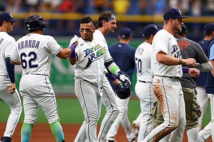 Jun 25, 2022; St. Petersburg, Florida, USA; Tampa Bay Rays shortstop Isaac Paredes (17) is congratulated after hitting a walk off single against the Pittsburgh Pirates in the ninth inning at Tropicana Field. Mandatory Credit: Nathan Ray Seebeck-USA TODAY Sports