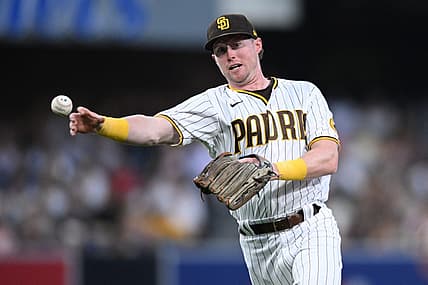 Jun 25, 2022; San Diego, California, USA; San Diego Padres second baseman Jake Cronenworth (9) throws to first base on a ground out by Philadelphia Phillies second baseman Yairo Munoz (not pictured) during the third inning at Petco Park. Mandatory Credit: Orlando Ramirez-USA TODAY Sports