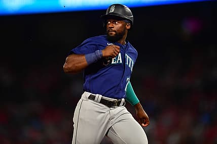June 25, 2022; Anaheim, California, USA; Seattle Mariners pinch runner Taylor Trammell (20) reaches third against the Los Angeles Angels during the seventh inning at Angel Stadium. Mandatory Credit: Gary A. Vasquez-USA TODAY Sports