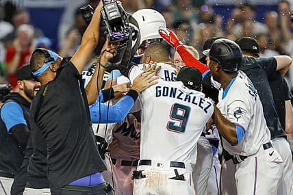 Jun 26, 2022; Miami, Florida, USA; Miami Marlins celebrate at home plate after a walk-off home run by catcher Nick Fortes (54) in the ninth inning against the New York Mets at loanDepot Park. Mandatory Credit: Sam Navarro-USA TODAY Sports
