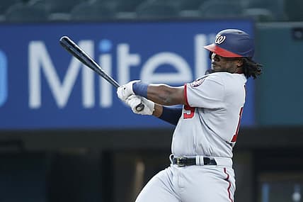 Jun 26, 2022; Arlington, Texas, USA; Washington Nationals first baseman Josh Bell (19) singles in the first inning against the Texas Rangers at Globe Life Field. Mandatory Credit: Tim Heitman-USA TODAY Sports