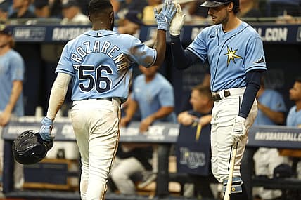 Jun 26, 2022; St. Petersburg, Florida, USA;  Tampa Bay Rays right fielder Randy Arozarena (56) is congratulated by  center fielder Josh Lowe (15) after he scores a run against the Pittsburgh Pirates during the seventh inning at Tropicana Field. Mandatory Credit: Kim Klement-USA TODAY Sports