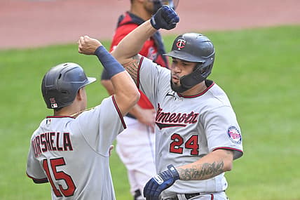 Jun 27, 2022; Cleveland, Ohio, USA; Minnesota Twins designated hitter Gary Sanchez (24) celebrates his three run home run with third baseman Gio Urshela (15) in the second inning against the Cleveland Guardians at Progressive Field. Mandatory Credit: David Richard-USA TODAY Sports