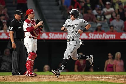 Jun 27, 2022; Anaheim, California, USA; Chicago White Sox designated hitter Andrew Vaughn (25) crosses home plate to score in the sixth inning as Los Angeles Angels catcher Max Stassi (33) watches at Angel Stadium. Mandatory Credit: Kirby Lee-USA TODAY Sports