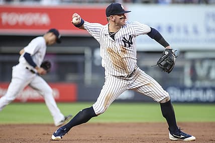 Jun 28, 2022; Bronx, New York, USA;  New York Yankees third baseman Josh Donaldson (28) throws a runner out at first base in the third inning against the Oakland Athletics at Yankee Stadium. Mandatory Credit: Wendell Cruz-USA TODAY Sports