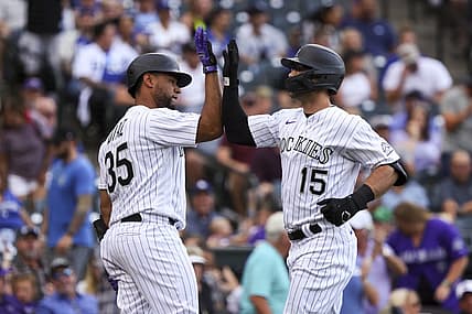 Jun 28, 2022; Denver, Colorado, USA; Colorado Rockies center fielder Randal Grichuk (15) high fives catcher Elias Diaz (35) after hitting a home run against the Los Angeles Dodgers during the second inning at Coors Field. Mandatory Credit: Michael Ciaglo-USA TODAY Sports