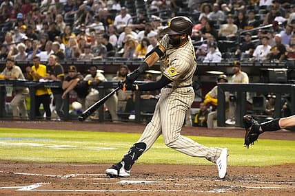 Jun 28, 2022; Phoenix, Arizona, USA; San Diego Padres right fielder Nomar Mazara (16) hits a two run homerun against the Arizona Diamondbacks in the fourth inning at Chase Field. Mandatory Credit: Rick Scuteri-USA TODAY Sports