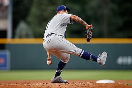 Jun 29, 2022; Denver, Colorado, USA; Los Angeles Dodgers starting pitcher Julio Urias (7) pitches in the first inning against the Colorado Rockies at Coors Field. Mandatory Credit: Isaiah J. Downing-USA TODAY Sports