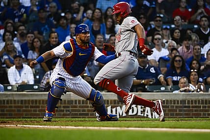 Jun 29, 2022; Chicago, Illinois, USA; Chicago Cubs catcher Willson Contreras (40) tags out Cincinnati Reds left fielder Tommy Pham (28) at home plate during the fourth inning at Wrigley Field. Mandatory Credit: Matt Marton-USA TODAY Sports