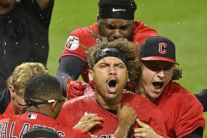 Jun 29, 2022; Cleveland, Ohio, USA; Cleveland Guardians first baseman Josh Naylor (center) celebrates his game-winning two-run home run in the tenth inning against the Minnesota Twins at Progressive Field. Mandatory Credit: David Richard-USA TODAY Sports